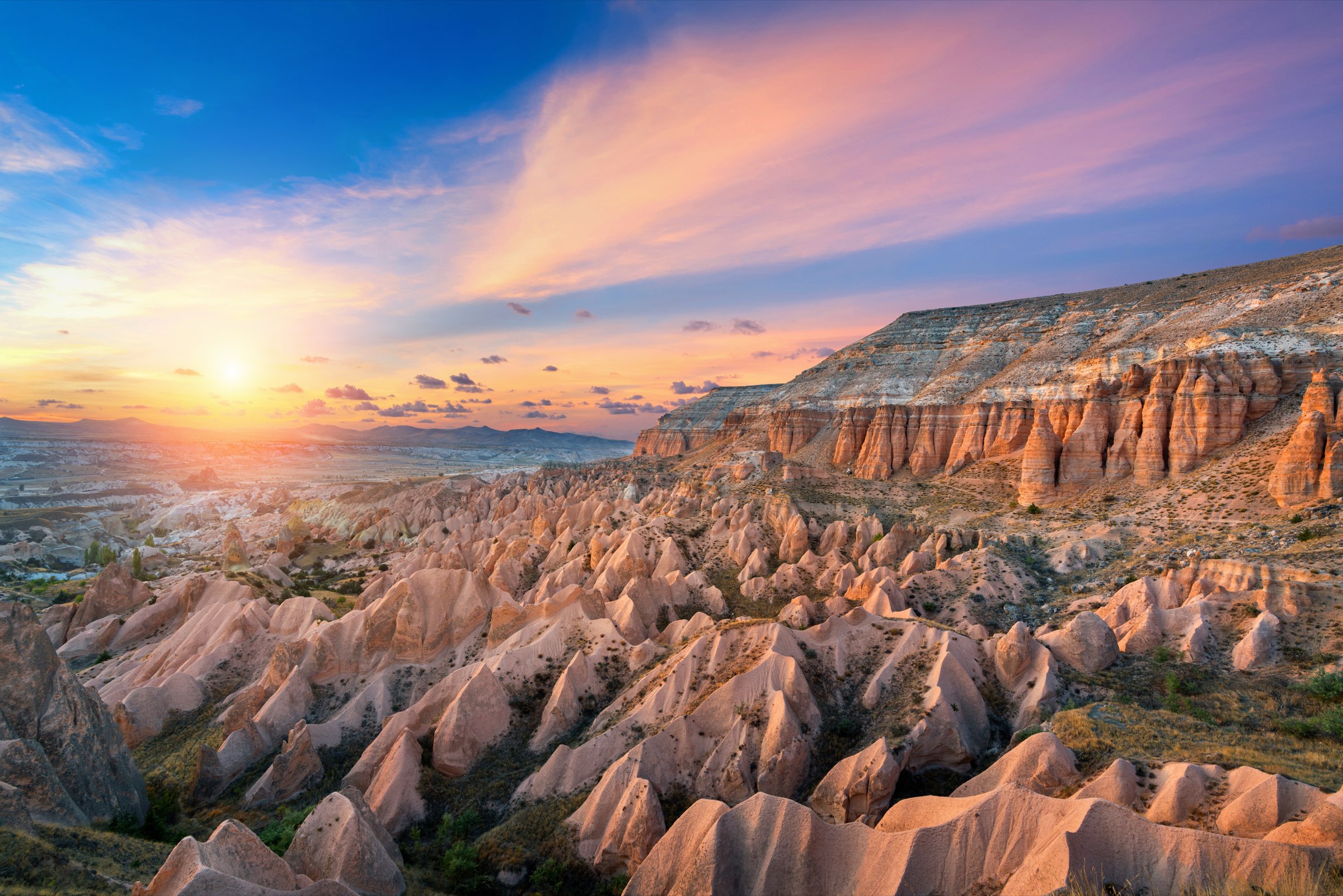 Sunset over the rose-hued canyons of Cappadocia